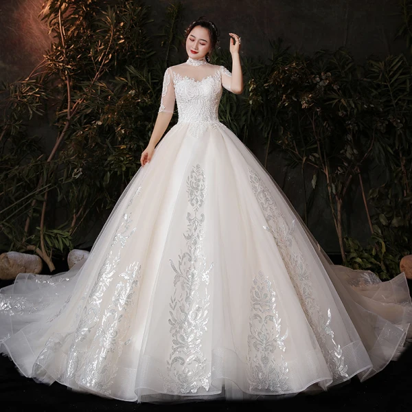 Vintage / Originale Champagne Grande Taille Robe De Mariée 2020 Robe Boule Transparentes Col Haut 1/2 Manches Dos Nu Appliques En Dentelle Glitter Tulle Cathedral Train Volants