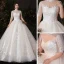 Vintage / Originale Champagne Grande Taille Robe De Mariée 2020 Robe Boule Transparentes Col Haut 1/2 Manches Dos Nu Appliques En Dentelle Glitter Tulle Cathedral Train Volants
