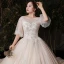 Viktorianischer Stil Champagner Plus Größe Brautkleider / Hochzeitskleider 2020 Ballkleid Durchsichtige Rundhalsausschnitt Geschwollenes 1/2 Ärmel Rückenfreies Applikationen Spitze Perlenstickerei Glanz Tülle Kathedrale Schleppe Rüschen