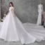 Luxe Blanche Transparentes La Mariée Robe De Mariée 2020 Robe Boule Encolure Dégagée Manches Courtes Perlage Gland Dos Nu Paillettes Glitter Tulle Cathedral Train Volants