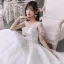 Luxe Blanche Transparentes La Mariée Robe De Mariée 2020 Robe Boule Encolure Dégagée Manches Courtes Perlage Gland Dos Nu Paillettes Glitter Tulle Cathedral Train Volants