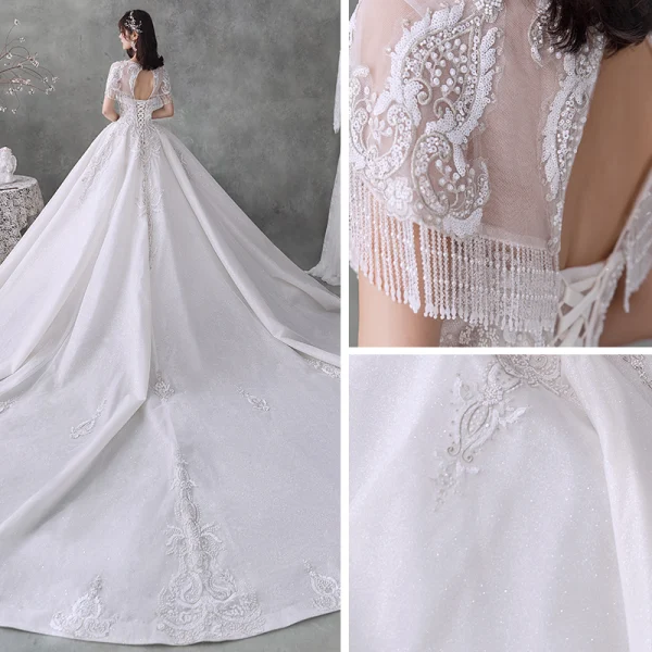 Luxe Blanche Transparentes La Mariée Robe De Mariée 2020 Robe Boule Encolure Dégagée Manches Courtes Perlage Gland Dos Nu Paillettes Glitter Tulle Cathedral Train Volants