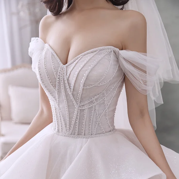 Romantic Champagne Bridal Wedding Dresses 2020 Ball Gown Off-The-Shoulder Short Sleeve Backless Beading Glitter Tulle Cathedral Train Ruffle