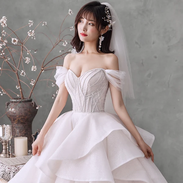 Romantic Champagne Bridal Wedding Dresses 2020 Ball Gown Off-The-Shoulder Short Sleeve Backless Beading Glitter Tulle Cathedral Train Ruffle