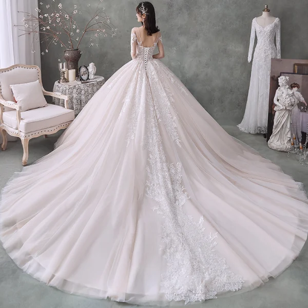 Fabulous Champagne See-through Wedding Dresses 2020 Ball Gown Scoop Neck 3/4 Sleeve Backless Appliques Lace Beading Cathedral Train Ruffle