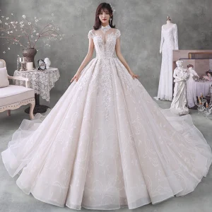 Vintage Champán Transparentes Boda Vestidos De Novia 2020 Ball Gown Cuello Alto Manga Corta Sin Espalda Apliques Con Encaje Rebordear Lentejuelas Cathedral Train Ruffle