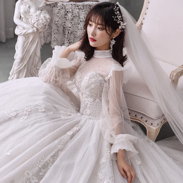 Style Victorien Ivoire La Mariée Robe De Mariée 2020 Robe Boule Transparentes Col Haut Gonflée Manches Longues Dos Nu Appliques En Dentelle Perlage Perle Glitter Tulle Cathedral Train Volants