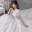 Style Victorien Ivoire La Mariée Robe De Mariée 2020 Robe Boule Transparentes Encolure Dégagée Gonflée Manches Courtes Dos Nu Perlage Gland Glitter Tulle Cathedral Train Volants