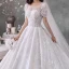 Style Victorien Ivoire La Mariée Robe De Mariée 2020 Robe Boule Transparentes Encolure Dégagée Gonflée Manches Courtes Dos Nu Perlage Gland Glitter Tulle Cathedral Train Volants