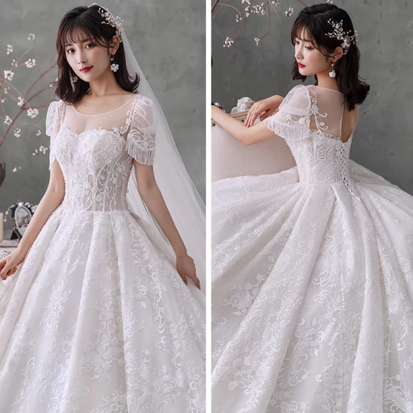 Style Victorien Ivoire La Mariée Robe De Mariée 2020 Robe Boule Transparentes Encolure Dégagée Gonflée Manches Courtes Dos Nu Perlage Gland Glitter Tulle Cathedral Train Volants
