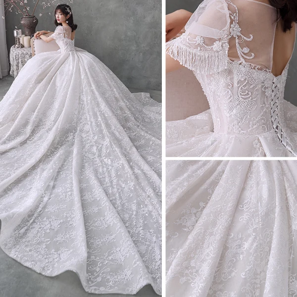 Style Victorien Ivoire La Mariée Robe De Mariée 2020 Robe Boule Transparentes Encolure Dégagée Gonflée Manches Courtes Dos Nu Perlage Gland Glitter Tulle Cathedral Train Volants