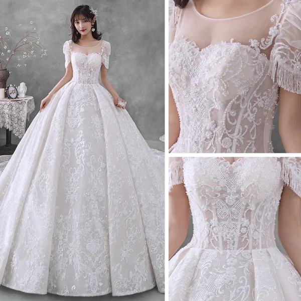 Style Victorien Ivoire La Mariée Robe De Mariée 2020 Robe Boule Transparentes Encolure Dégagée Gonflée Manches Courtes Dos Nu Perlage Gland Glitter Tulle Cathedral Train Volants