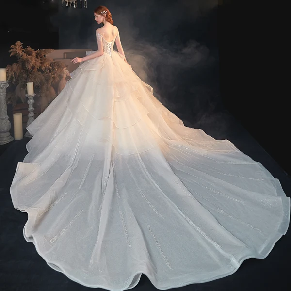 Luxe Champagne Transparentes La Mariée Robe De Mariée 2020 Princesse Encolure Dégagée Manches Courtes Dos Nu Perlage Paillettes Glitter Tulle Cathedral Train Volants