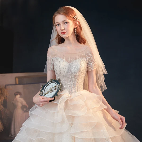 Luxe Champagne Transparentes La Mariée Robe De Mariée 2020 Princesse Encolure Dégagée Manches Courtes Dos Nu Perlage Paillettes Glitter Tulle Cathedral Train Volants
