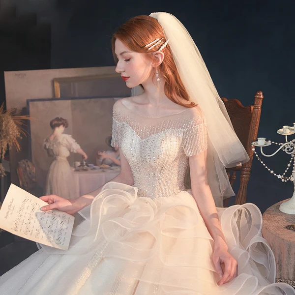 Luxe Champagne Transparentes La Mariée Robe De Mariée 2020 Princesse Encolure Dégagée Manches Courtes Dos Nu Perlage Paillettes Glitter Tulle Cathedral Train Volants