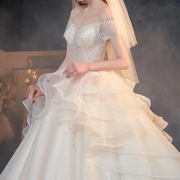 Luxe Champagne Transparentes La Mariée Robe De Mariée 2020 Princesse Encolure Dégagée Manches Courtes Dos Nu Perlage Paillettes Glitter Tulle Cathedral Train Volants