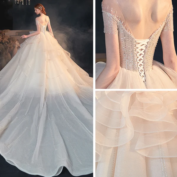 Luxe Champagne Transparentes La Mariée Robe De Mariée 2020 Princesse Encolure Dégagée Manches Courtes Dos Nu Perlage Paillettes Glitter Tulle Cathedral Train Volants