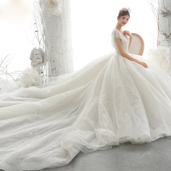 Luxury / Gorgeous Champagne Bridal Wedding Dresses 2020 Ball Gown See-through V-Neck Short Sleeve Backless Appliques Sequins Beading Cathedral Train Ruffle