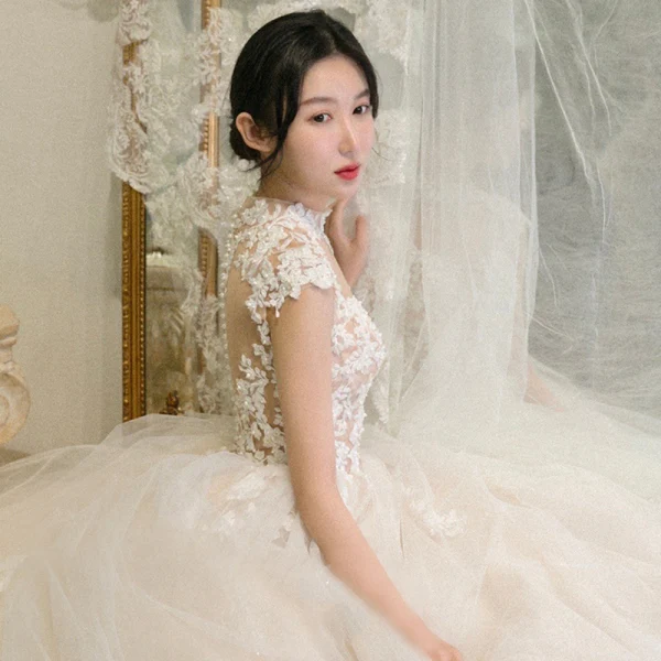 Illusion Champagne See-through Bridal Wedding Dresses 2020 Ball Gown High Neck Sleeveless Appliques Lace Beading Cathedral Train