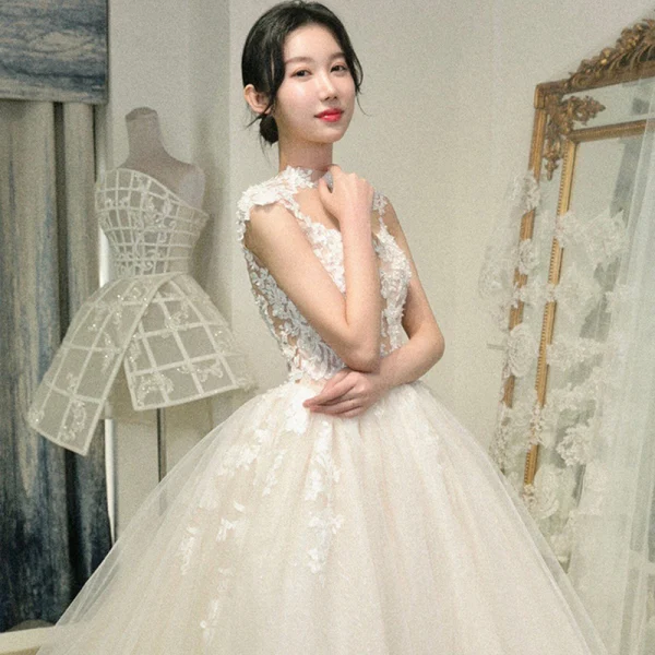 Illusion Champagne See-through Bridal Wedding Dresses 2020 Ball Gown High Neck Sleeveless Appliques Lace Beading Cathedral Train