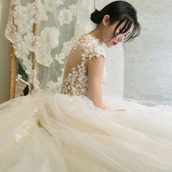Illusion Champagne See-through Bridal Wedding Dresses 2020 Ball Gown High Neck Sleeveless Appliques Lace Beading Cathedral Train