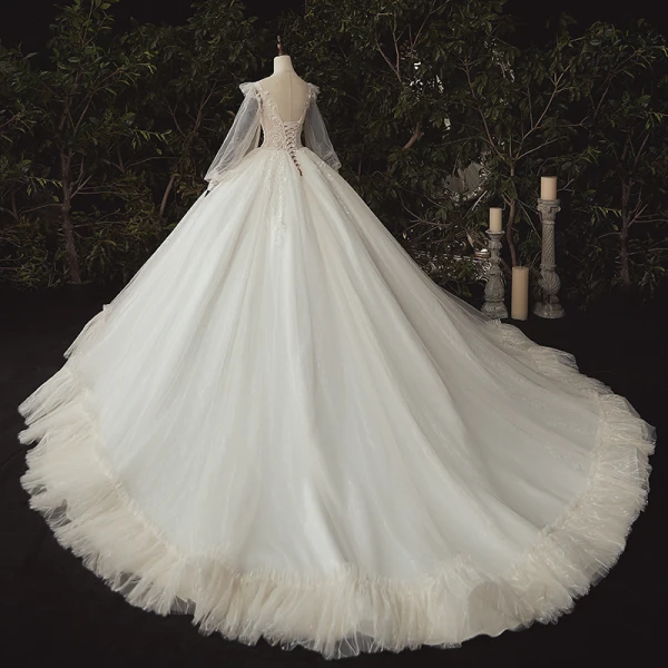 Luxe Ivoire La Mariée Robe De Mariée 2020 Robe Boule Transparentes Col v profond Gonflée Manches Longues Dos Nu Appliques En Dentelle Paillettes Perlage Cathedral Train Volants