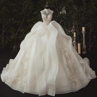 Stunning Ivory Bridal Wedding Dresses 2020 Ball Gown See Through High Neck Sleeveless Appliques Lace Beading Glitter Tulle Chapel Train Ruffle
