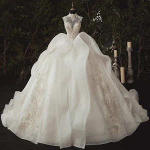 Maravilloso Marfil Boda Vestidos De Novia 2020 Ball Gown Transparentes Cuello Alto Sin Mangas Apliques Con Encaje Rebordear Glitter Tul Chapel Train Ruffle