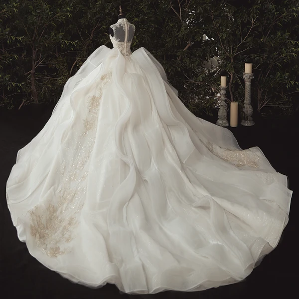 Stunning Ivory Bridal Wedding Dresses 2020 Ball Gown See-through High Neck Sleeveless Appliques Lace Beading Glitter Tulle Chapel Train Ruffle