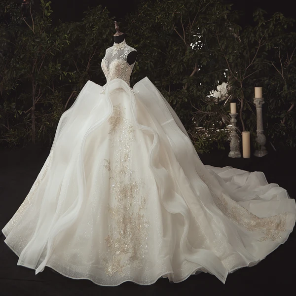 Stunning Ivory Bridal Wedding Dresses 2020 Ball Gown See-through High Neck Sleeveless Appliques Lace Beading Glitter Tulle Chapel Train Ruffle