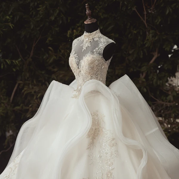 Stunning Ivory Bridal Wedding Dresses 2020 Ball Gown See-through High Neck Sleeveless Appliques Lace Beading Glitter Tulle Chapel Train Ruffle