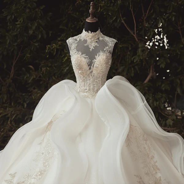 Stunning Ivory Bridal Wedding Dresses 2020 Ball Gown See-through High Neck Sleeveless Appliques Lace Beading Glitter Tulle Chapel Train Ruffle