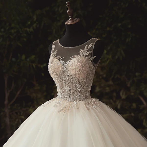 Illusion Ivoire La Mariée Robe De Mariée 2020 Robe Boule Transparentes Encolure Dégagée Sans Manches Dos Nu Appliques Paillettes Perlage Cathedral Train Volants