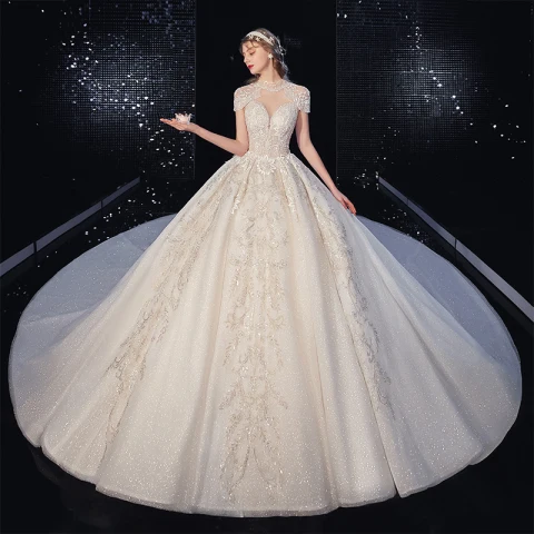 Vintage Champagne Doorzichtige Bruids Trouwjurken 2020 Baljurk Hoge Kraag Korte Mouwen Ruglooze Appliques Kant Kralen Kwast Glans Tule Royal Train Ruche