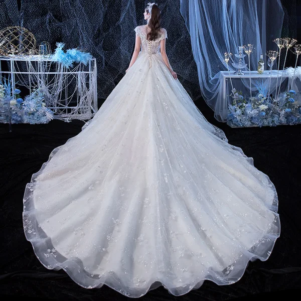 Illusion Ivory See-through Bridal Wedding Dresses 2020 Ball Gown Scoop Neck Short Sleeve Backless Appliques Flower Beading Cathedral Train