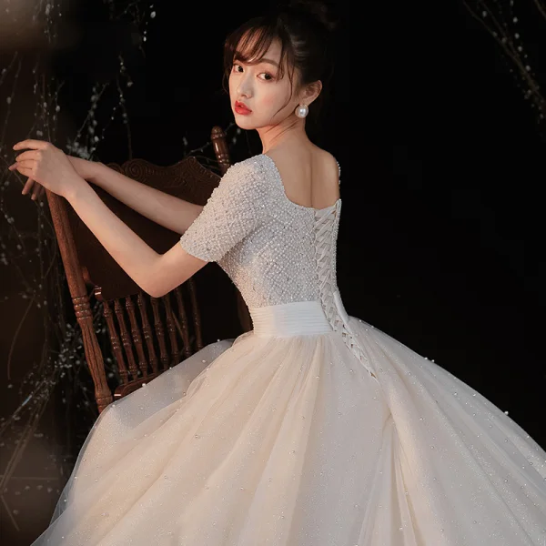 Luxury / Gorgeous Champagne Bridal Wedding Dresses 2020 Ball Gown Square Neckline Short Sleeve Backless Handmade Beading Pearl Glitter Tulle Cathedral Train Ruffle