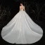 Illusion Ivoire Satin La Mariée Robe De Mariée 2020 Robe Boule Transparentes Encolure Dégagée Manches Courtes Dos Nu Appliques En Dentelle Perlage Cathedral Train