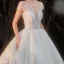 Illusion Ivoire Satin La Mariée Robe De Mariée 2020 Robe Boule Transparentes Encolure Dégagée Manches Courtes Dos Nu Appliques En Dentelle Perlage Cathedral Train