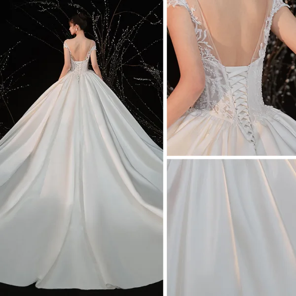 Illusion Ivoire Satin La Mariée Robe De Mariée 2020 Robe Boule Transparentes Encolure Dégagée Manches Courtes Dos Nu Appliques En Dentelle Perlage Cathedral Train