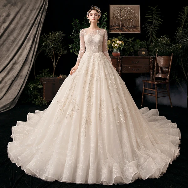 Chic / Beautiful Champagne See-through Bridal Wedding Dresses 2020 Ball Gown Scoop Neck Long Sleeve Backless Appliques Flower Beading Sequins Cathedral Train Ruffle