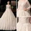 Chic / Beautiful Champagne See-through Bridal Wedding Dresses 2020 Ball Gown Scoop Neck Long Sleeve Backless Appliques Flower Beading Sequins Cathedral Train Ruffle