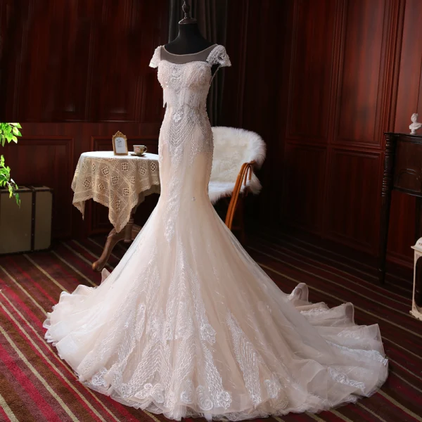 Luxe Champagne La Mariée Robe De Mariée 2020 Trompette / Sirène Transparentes Encolure Carrée Manches Courtes Dos Nu Appliques En Dentelle Fait main Perlage Gland Tribunal Train Volants