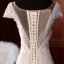 Luxe Champagne La Mariée Robe De Mariée 2020 Trompette / Sirène Transparentes Encolure Carrée Manches Courtes Dos Nu Appliques En Dentelle Fait main Perlage Gland Tribunal Train Volants