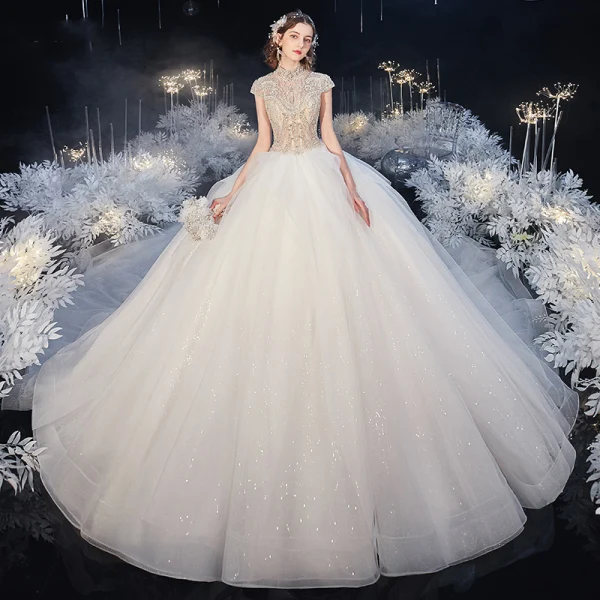 Luxury / Gorgeous Ivory See-through Bridal Wedding Dresses 2020 Ball Gown High Neck Short Sleeve Backless Beading Glitter Tulle Royal Train Ruffle