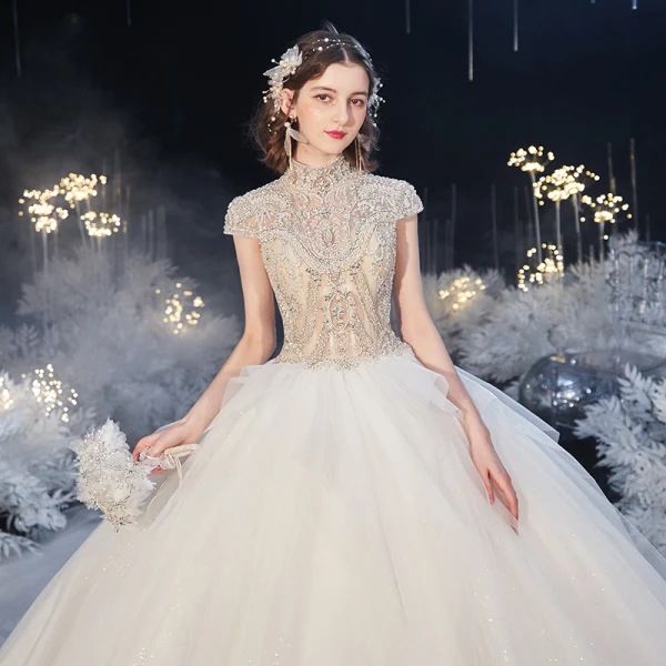 Luxury / Gorgeous Ivory See-through Bridal Wedding Dresses 2020 Ball Gown High Neck Short Sleeve Backless Beading Glitter Tulle Royal Train Ruffle