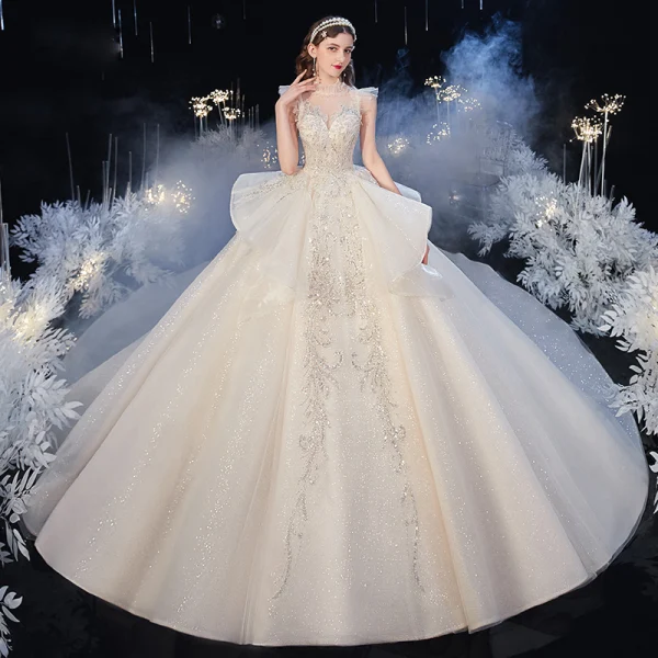 Vintage / Originale Champagne Transparentes La Mariée Robe De Mariée 2020 Robe Boule Col Haut Sans Manches Dos Nu Appliques Paillettes Perlage Glitter Tulle Cathedral Train Volants