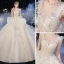 Vintage / Originale Champagne Transparentes La Mariée Robe De Mariée 2020 Robe Boule Col Haut Sans Manches Dos Nu Appliques Paillettes Perlage Glitter Tulle Cathedral Train Volants
