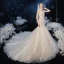 Élégant Champagne La Mariée Robe De Mariée 2020 Trompette / Sirène Transparentes Col v profond Sans Manches Dos Nu Appliques En Dentelle Paillettes Perlage Chapel Train