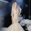 Élégant Champagne La Mariée Robe De Mariée 2020 Trompette / Sirène Transparentes Col v profond Sans Manches Dos Nu Appliques En Dentelle Paillettes Perlage Chapel Train