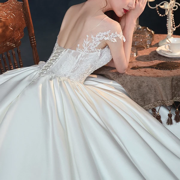 Illusion Ivory Satin See-through Bridal Wedding Dresses 2020 Ball Gown Scoop Neck Short Sleeve Backless Appliques Lace Beading Chapel Train Ruffle
